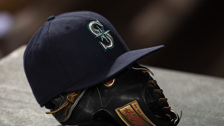 Apr 27, 2015; Arlington, TX, USA; A view of a Seattle Mariners hat and baseball glove during the game between the Texas Rangers and the Mariners at Globe Life Park in Arlington. The Mariners defeated the Rangers 3-1. Mandatory Credit: Jerome Miron-Imagn Images