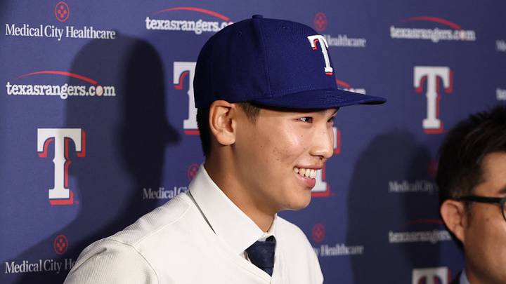 May 18, 2025; Arlington, Texas, USA; Seong-Jun Kim of the Texas Rangers talks to the media after signing with the team before the game against the Houston Astros at Globe Life Field. Mandatory Credit: Tim Heitman-Imagn Images