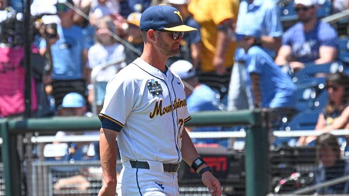 Jun 17, 2026; Omaha, NE, USA;  West Virginia Mountaineers head coach Steve Sabins walks to the dugout before the game against the North Carolina Tar Heels at Charles Schwab Field. Mandatory Credit: Steven Branscombe-Imagn Images