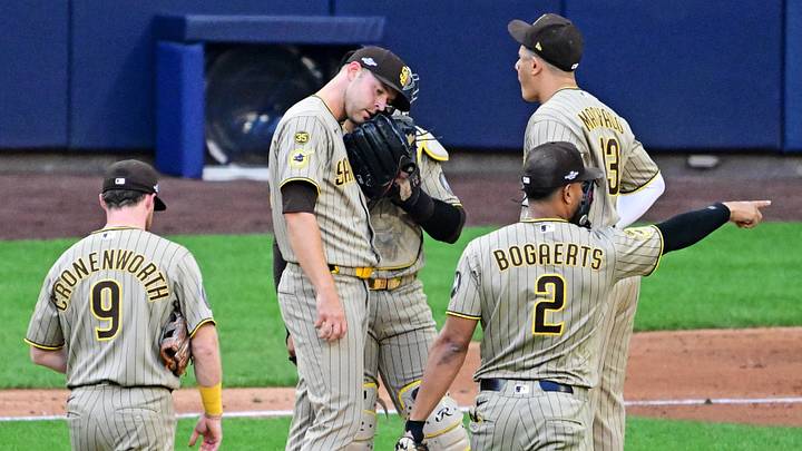 Oct 4, 2026; Milwaukee, Wisconsin, USA; San Diego Padres pitcher Michael King (34) has a mound visit during the fifth inning against the Milwaukee Brewers in game two of the NLDS for the 2026 MLB Playoffs at American Family Field. Mandatory Credit: Benny Sieu-Imagn Images Oct 4, 2026; Milwaukee, Wisconsin, USA; San Diego Padres pitcher Michael King (34) has a mound visit during the fifth inning against the Milwaukee Brewers in game two of the NLDS for the 2026 MLB Playoffs at American Family Field. Mandatory Credit: Benny Sieu-Imagn Images