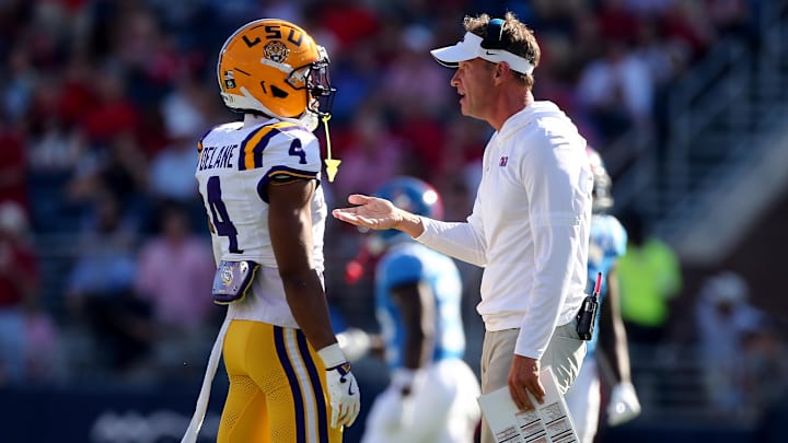 Sep 27, 2025; Oxford, Mississippi, USA; Mississippi Rebels head coach Lane Kiffin talks with LSU Tigers cornerback Mansoor Delane (4) during the second quarter at Vaught-Hemingway Stadium. Mandatory Credit: Petre Thomas-Imagn Images