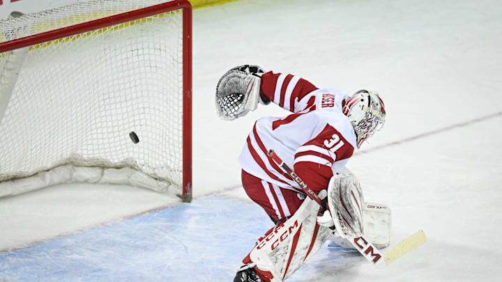 A shot by Michigan State center Charlie Stramel (15) bounces off the crossbar behind Wisconsin goaltender Daniel Hauser (31) in a game Thursday, January 15, 2026, at the Kohl Center in Madison, Wisconsin.