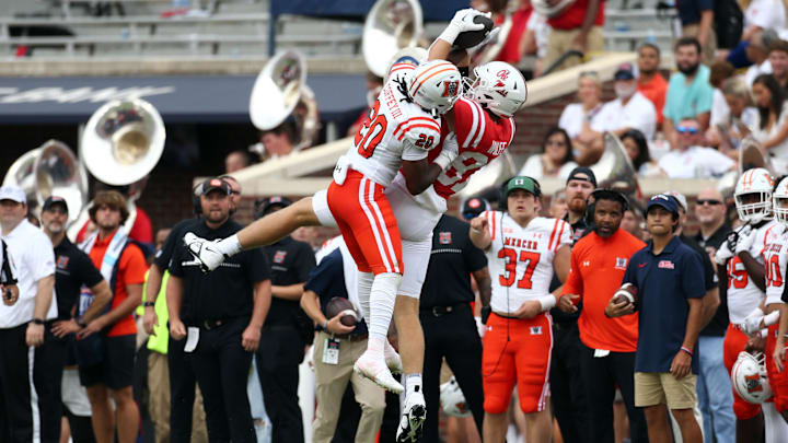 Sep 2, 2023; Oxford, Mississippi, USA; Mississippi Rebels tight end Hudson Wolfe (87) catches a pass over Mercer Bears defensive back Richie Coffey (20) during the first half at Vaught-Hemingway Stadium. Mandatory Credit: Petre Thomas-Imagn Images Sep 2, 2023; Oxford, Mississippi, USA; Mississippi Rebels tight end Hudson Wolfe (87) catches a pass over Mercer Bears defensive back Richie Coffey (20) during the first half at Vaught-Hemingway Stadium. Mandatory Credit: Petre Thomas-Imagn Images
