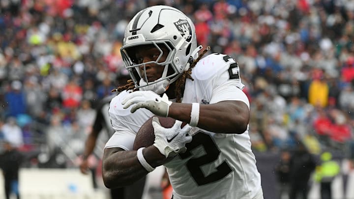 Sep 7, 2025; Foxborough, Massachusetts, USA; Las Vegas Raiders running back Ashton Jeanty (2) rushes the ball against the New England Patriots during he second half at Gillette Stadium. 