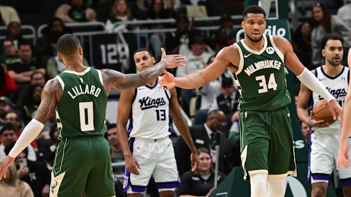 Jan 14, 2025; Milwaukee, Wisconsin, USA; Milwaukee Bucks forward Giannis Antetokounmpo (34) reacts with guard Damian Lillard (0) after scoring a basket in the second quarter against the Sacramento Kings at Fiserv Forum. Mandatory Credit: Benny Sieu-Imagn Images