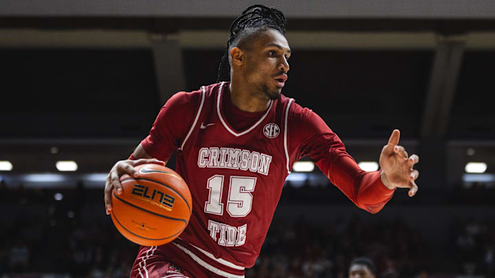 Jan 25, 2025; Tuscaloosa, Alabama, USA; Alabama Crimson Tide forward Jarin Stevenson (15) drives the ball against the LSU Tigers during the first half at Coleman Coliseum. Mandatory Credit: Will McLelland-Imagn Images