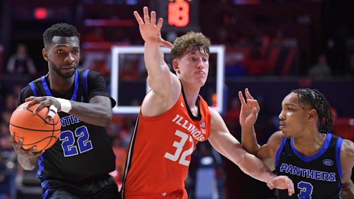 Nov 4, 2024; Champaign, Illinois, USA;  Illinois Fighting Illini guard Kasparas Jakucionis (32) gets between Eastern Illinois Panthers forward Sekou Kalle (22) and guard Nakyel Shelton (3) during the second half at State Farm Center. Mandatory Credit: Ron Johnson-Imagn Images