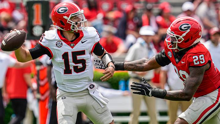 Apr 18, 2026; Athens, GA, USA; Georgia Bulldogs quarterback Ryan Montgomery (15) tries to pass pressured by linebacker Isaiah Gibson (29) during the Georgia Spring football game at Sanford Stadium. Mandatory Credit: Dale Zanine-Imagn Images