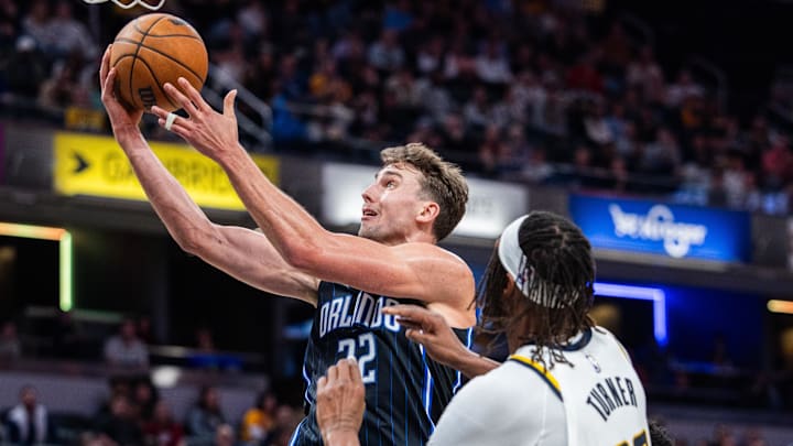 Orlando Magic forward Franz Wagner (22) shoots the ball while Indiana Pacers center Myles Turner (33) defends in the second half at Gainbridge Fieldhouse.