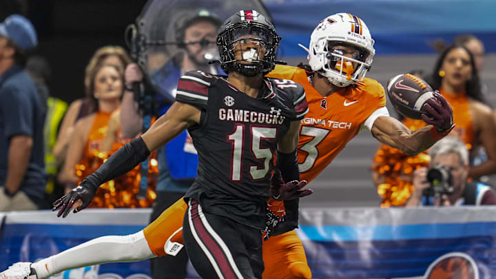 Aug 31, 2025; Atlanta, Georgia, USA; Virginia Tech Hokies wide receiver Donavon Greene (3) tries to make a one handed catch behind South Carolina Gamecocks defensive back Brandon Cisse (15) during the second half at Mercedes-Benz Stadium.