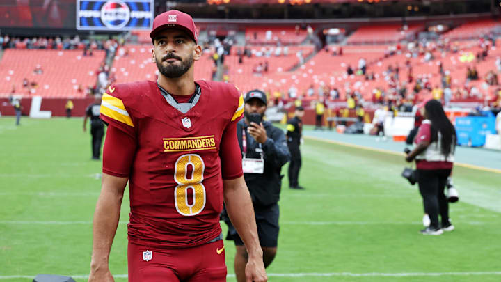 Sep 21, 2025; Landover, Maryland, USA; Washington Commanders quarterback Marcus Mariota (8) walks off the field after the game against Las Vegas Raiders at Northwest Stadium. Mandatory Credit: Geoff Burke-Imagn Images