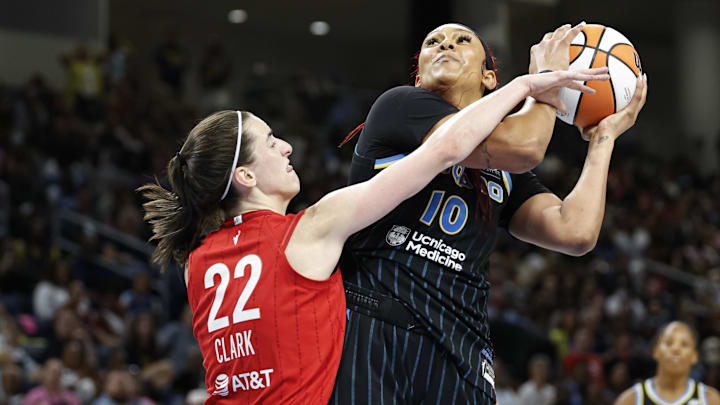 Aug 30, 2024; Chicago, Illinois, USA; Indiana Fever guard Caitlin Clark (22) fouls Chicago Sky center Kamilla Cardoso (10) during the second half at Wintrust Arena. Mandatory Credit: Kamil Krzaczynski-USA TODAY Sports Aug 30, 2024; Chicago, Illinois, USA; Indiana Fever guard Caitlin Clark (22) fouls Chicago Sky center Kamilla Cardoso (10) during the second half at Wintrust Arena. Mandatory Credit: Kamil Krzaczynski-USA TODAY Sports