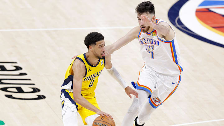 Jun 16, 2025; Oklahoma City, Oklahoma, USA; Indiana Pacers guard Tyrese Haliburton (0) drives to the basket past Oklahoma City Thunder forward Chet Holmgren (7) during the fourth quarter in game five of the 2025 NBA Finals at Paycom Center. Mandatory Credit: Alonzo Adams-Imagn Images