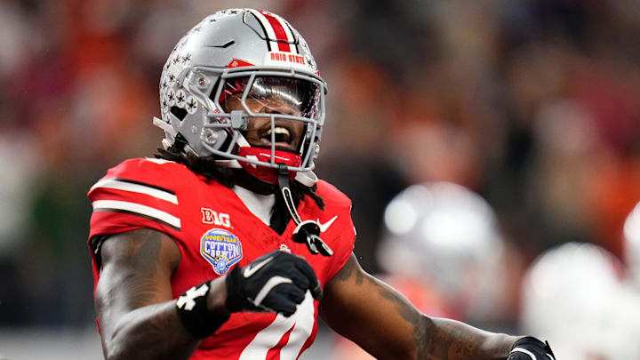 Ohio State Buckeyes wide receiver Jeremiah Smith (4) celebrates a touchdown during the Cotton Bowl at AT&T Stadium in Arlington, Texas for the College Football Playoff quarterfinal game against the Miami Hurricanes on Dec. 31, 2025. Ohio State lost 24-14.