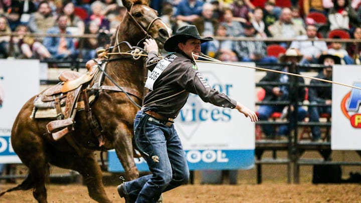 Marty Yates runs to tie down a calf during the San Angelo Stock Show & Rodeo performance Thursday, Feb. 14, 2019, at Foster Communications Coliseum.

San Angelo Stock Show Rodeo Performance Thursday Feb 14 2019