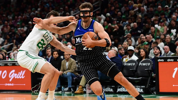 Nov 23, 2025; Boston, Massachusetts, USA; Boston Celtics guard Hugo Gonzalez (28) defends Orlando Magic forward Franz Wagner (22) during the first half at TD Garden. Mandatory Credit: Bob DeChiara-Imagn Images