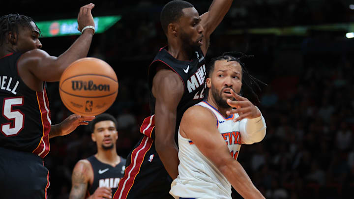 Oct 26, 2025; Miami, Florida, USA;  New York Knicks guard Jalen Brunson (11) passes the basketball as Miami Heat forward Andrew Wiggins (22) defends during the third quarter at Kaseya Center. Mandatory Credit: Sam Navarro-Imagn Images