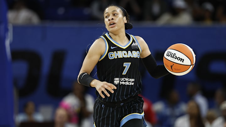 Aug 25, 2024; Chicago, Illinois, USA; Chicago Sky guard Chennedy Carter (7) brings the ball up court against the Las Vegas Aces during the first half at Wintrust Arena. Mandatory Credit: Kamil Krzaczynski-Imagn Images