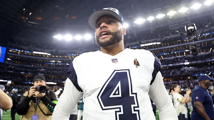 Dallas Cowboys quarterback Dak Prescott smiles on the field after the game against the Philadelphia Eagles.