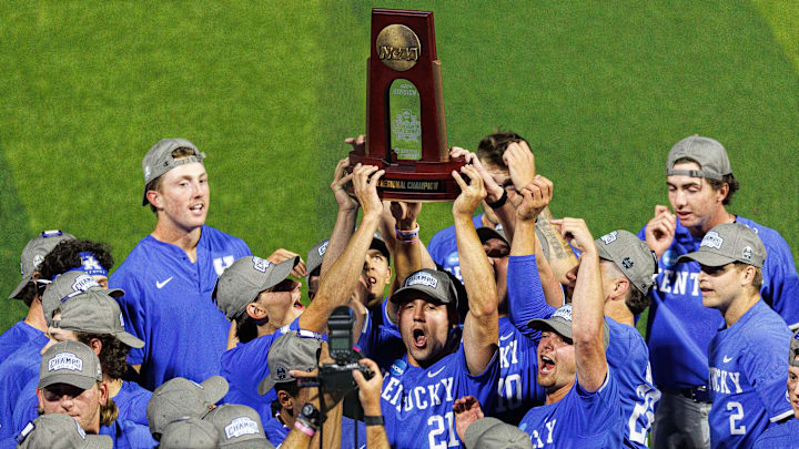Jun 9, 2024; Lexington, KY, USA; Kentucky Wildcats outfielder Ryan Waldschmidt (21) holds up the NCAA Super Regional Championship trophy after winning against the Oregon State Beavers at Kentucky Proud Park. Mandatory Credit: Jordan Prather-USA TODAY Sports