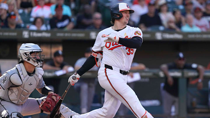 Sep 2, 2024; Baltimore, Maryland, USA; Baltimore Orioles catcher Adley Rutschman (35) drives in a run during the fifth inning against the Chicago White Sox at Oriole Park at Camden Yards. 