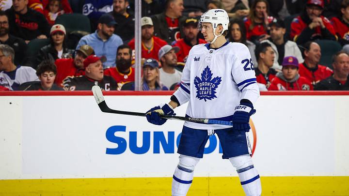 Feb 2, 2026; Calgary, Alberta, CAN; Toronto Maple Leafs defenseman Troy Stecher (28) against the Calgary Flames during the third period at Scotiabank Saddledome. Mandatory Credit: Sergei Belski-Imagn Images