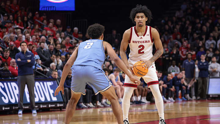 Dec 30, 2024; Piscataway, New Jersey, USA; Rutgers Scarlet Knights guard Dylan Harper (2) looks to pass during the second half as Columbia Lions guard Kenny Noland (2) defends at Jersey Mike's Arena. Mandatory Credit: Vincent Carchietta-Imagn Images