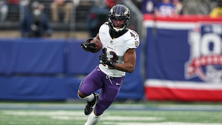Dec 15, 2024; East Rutherford, New Jersey, USA; Baltimore Ravens running back Justice Hill (43) carries the ball during the second half against the New York Giants at MetLife Stadium. Mandatory Credit: Vincent Carchietta-Imagn Images Dec 15, 2024; East Rutherford, New Jersey, USA; Baltimore Ravens running back Justice Hill (43) carries the ball during the second half against the New York Giants at MetLife Stadium. Mandatory Credit: Vincent Carchietta-Imagn Images