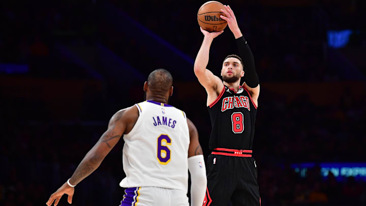 Mar 26, 2023; Los Angeles, California, USA; Chicago Bulls guard Zach LaVine (8) shoots against Los Angeles Lakers forward LeBron James (6) during the second half at Crypto.com Arena. Mandatory Credit: Gary A. Vasquez-Imagn Images