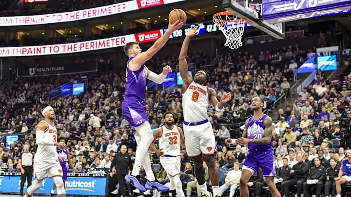 Nov 23, 2024; Salt Lake City, Utah, USA; Utah Jazz center Walker Kessler (24) shoots a layup over New York Knicks forward/guard OG Anunoby (8) during the second half at the Delta Center. Mandatory Credit: Christopher Creveling-Imagn Images Nov 23, 2024; Salt Lake City, Utah, USA; Utah Jazz center Walker Kessler (24) shoots a layup over New York Knicks forward/guard OG Anunoby (8) during the second half at the Delta Center. Mandatory Credit: Christopher Creveling-Imagn Images