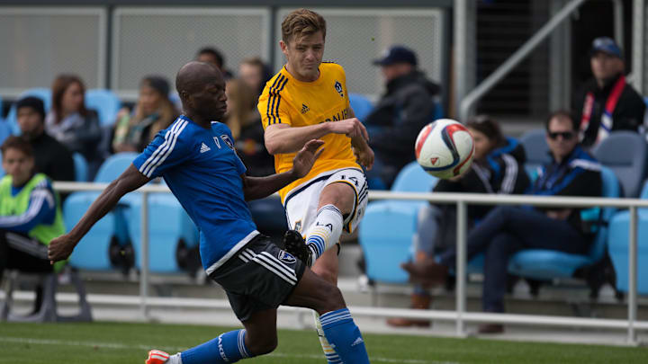 Feb 28, 2015; San Jose, CA, USA; Los Angeles Galaxy midfielder Robbie Rogers (14) kicks the ball against San Jose Earthquakes midfielder Sanna Nyassi (17) during the second half of the preseason game at Avaya Stadium. The San Jose Earthquakes defeated the Los Angeles Galaxy 3-2. Mandatory Credit: Kelley L Cox-Imagn Images Feb 28, 2015; San Jose, CA, USA; Los Angeles Galaxy midfielder Robbie Rogers (14) kicks the ball against San Jose Earthquakes midfielder Sanna Nyassi (17) during the second half of the preseason game at Avaya Stadium. The San Jose Earthquakes defeated the Los Angeles Galaxy 3-2. Mandatory Credit: Kelley L Cox-Imagn Images