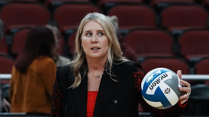 Louisville head coach Dani Busboom Kelly helps her team warm up ahead of their Final Four match against Pittsburgh at the KFC Yum! Center in Louisville, Ky. on Dec. 19, 2024.