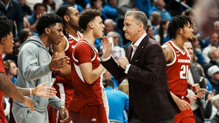 Arkansas head coach John Calipari gives high fives to his team as the Razorbacks took the half time lead over Kentucky Saturday Feb. 1, 2025 at Rupp Arena in Lexington, Kentucky.