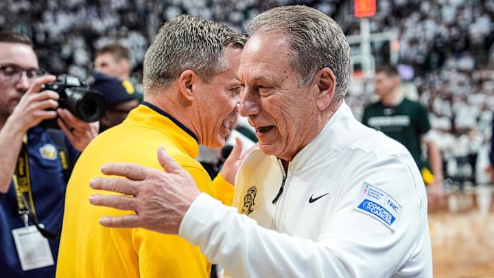 Michigan head coach Dusty May, left, talks to Michigan State head coach Tom Izzo before tipoff between Michigan State and Michigan at Breslin Center in East Lansing on Friday, Jan. 30, 2026.