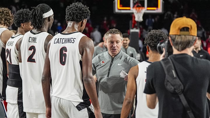 Mar 3, 2026; Athens, Georgia, USA; Georgia Bulldogs head coach Mike White reacts with his players after defeating the Alabama Crimson Tide at Stegeman Coliseum. Mandatory Credit: Dale Zanine-Imagn Images