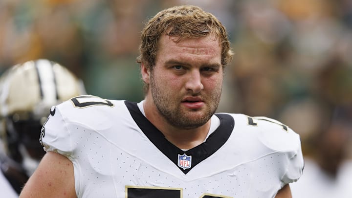 Sep 24, 2023; Green Bay, Wisconsin, USA; New Orleans Saints offensive tackle Trevor Penning (70) during warmups prior to the game against the Green Bay Packers at Lambeau Field. Mandatory Credit: Jeff Hanisch-Imagn Images Sep 24, 2023; Green Bay, Wisconsin, USA; New Orleans Saints offensive tackle Trevor Penning (70) during warmups prior to the game against the Green Bay Packers at Lambeau Field. Mandatory Credit: Jeff Hanisch-Imagn Images