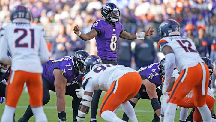 Baltimore Ravens quarterback Lamar Jackson (8) runs the offense during the third quarter against the Denver Broncos at M&T Bank Stadium. 