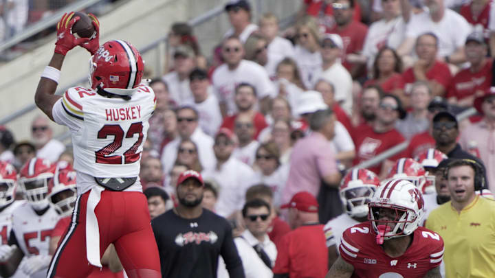 Sep 20, 2025; Madison, Wisconsin, USA; Maryland Terrapins defensive back Jalen Huskey (22) intercepts a pass intended for Wisconsin Badgers wide receiver Trech Kekahuna (2) during the first quarter at Camp Randall Stadium. Mandatory Credit: Mark Hoffman/USA Today Network via Imagn Images