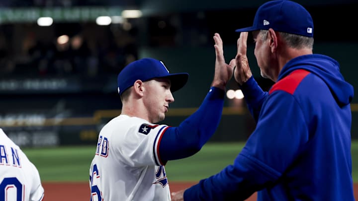 Apr 5, 2025; Arlington, Texas, USA; Texas Rangers left fielder Wyatt Langford (36) celebrates with Texas Rangers manager Bruce Bochy (15) after the game against the Tampa Bay Rays at Globe Life Field. Mandatory Credit: Kevin Jairaj-Imagn Images