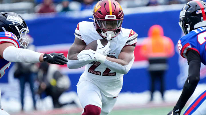 Washington Commanders running back Jacory Croskey-Merritt (22) runs against the Giants defense, Sunday, December 14, 2025. Washington Commanders running back Jacory Croskey-Merritt (22) runs against the Giants defense, Sunday, December 14, 2025.