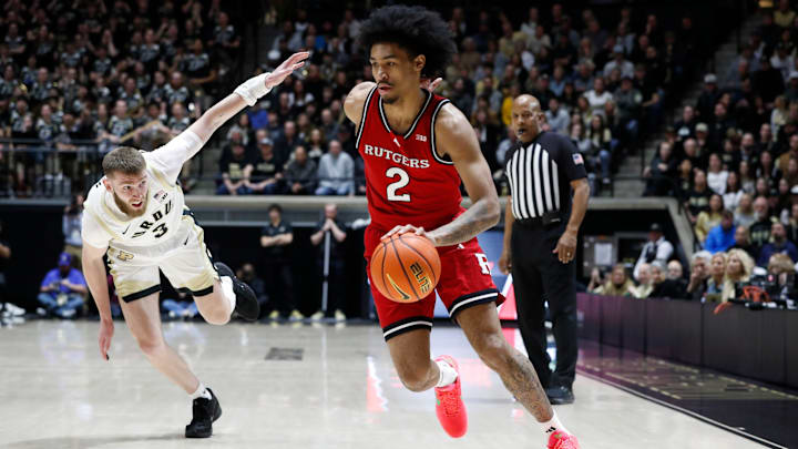 Rutgers Scarlet Knights guard Dylan Harper (2) drives past Purdue Boilermakers guard Braden Smith (3) Tuesday, March 4, 2025, during the NCAA men’s basketball game at Mackey Arena in West Lafayette, Ind.