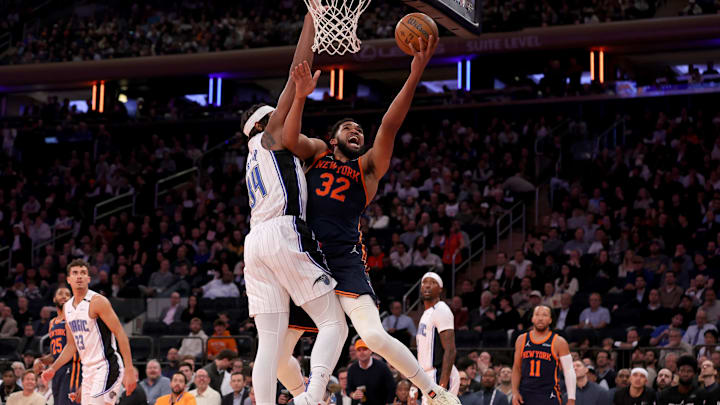 New York Knicks center Karl-Anthony Towns (32) drives to the basket against Orlando Magic center Wendell Carter Jr. (34) during the third quarter at Madison Square Garden.