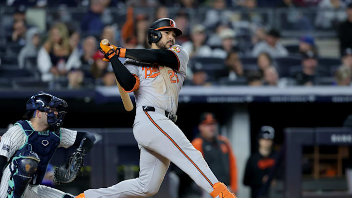 Sep 25, 2024; Bronx, New York, USA; Baltimore Orioles right fielder Anthony Santander (25) follows through on an RBI double against the New York Yankees during the fourth inning at Yankee Stadium. Sep 25, 2024; Bronx, New York, USA; Baltimore Orioles right fielder Anthony Santander (25) follows through on an RBI double against the New York Yankees during the fourth inning at Yankee Stadium.