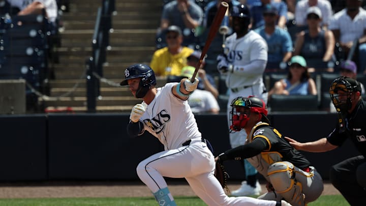 Apr 2, 2025; St. Petersburg, Florida, USA; Tampa Bay Rays outfielder Jonny DeLuca (21) hits a RBI single during the eighth inning against the Pittsburgh Pirates at George M. Steinbrenner Field. Apr 2, 2025; St. Petersburg, Florida, USA; Tampa Bay Rays outfielder Jonny DeLuca (21) hits a RBI single during the eighth inning against the Pittsburgh Pirates at George M. Steinbrenner Field.