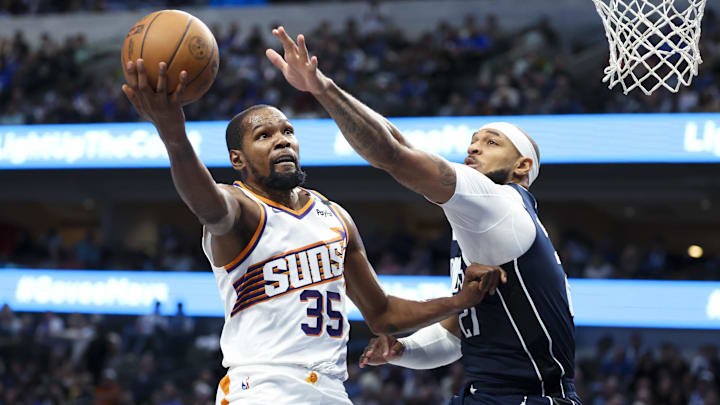 Nov 8, 2024; Dallas, Texas, USA; Phoenix Suns forward Kevin Durant (35) shoots past Dallas Mavericks center Daniel Gafford (21) during the third quarter at American Airlines Center. Mandatory Credit: Kevin Jairaj-Imagn Images