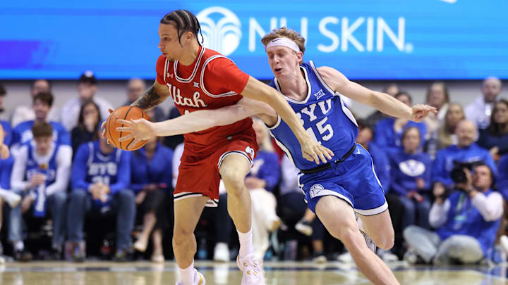 Mar 8, 2025; Provo, Utah, USA; Brigham Young Cougars forward Richie Saunders (15) reaches for the ball against Utah Utes guard Miro Little (1) during the second half at Marriott Center. Mandatory Credit: Rob Gray-Imagn Images