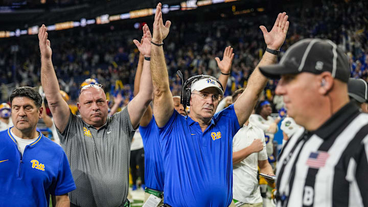 Pittsburgh Panthers head coach Pat Narduzzi lifts his hands up signaling touchdown after Pittsburgh Panthers quarterback Julian Dugger’s touchdown came under review during one of the six overtimes of the 2024 GameAbove Sports Bowl at Ford Field in Detroit, Thursday, Dec. 26, 2024. Pittsburgh Panthers head coach Pat Narduzzi lifts his hands up signaling touchdown after Pittsburgh Panthers quarterback Julian Dugger’s touchdown came under review during one of the six overtimes of the 2024 GameAbove Sports Bowl at Ford Field in Detroit, Thursday, Dec. 26, 2024.