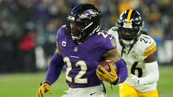 Jan 11, 2025; Baltimore, Maryland, USA; Baltimore Ravens running back Derrick Henry (22) runs against the Pittsburgh Steelers in the first quarter in an AFC wild card game at M&T Bank Stadium. Mandatory Credit: Mitch Stringer-Imagn Images