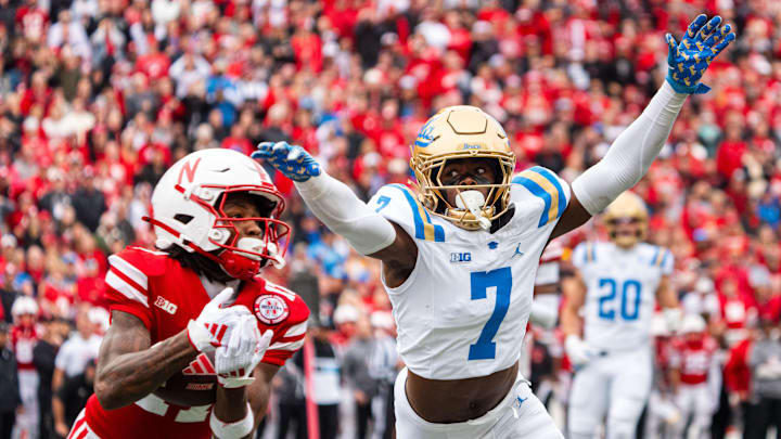 Nov 2, 2024; Lincoln, Nebraska, USA; Nebraska Cornhuskers wide receiver Jacory Barney Jr. (17) catches a pass against UCLA Bruins defensive back K.J. Wallace (7)  during the second quarter at Memorial Stadium. Mandatory Credit: Dylan Widger-Imagn Images