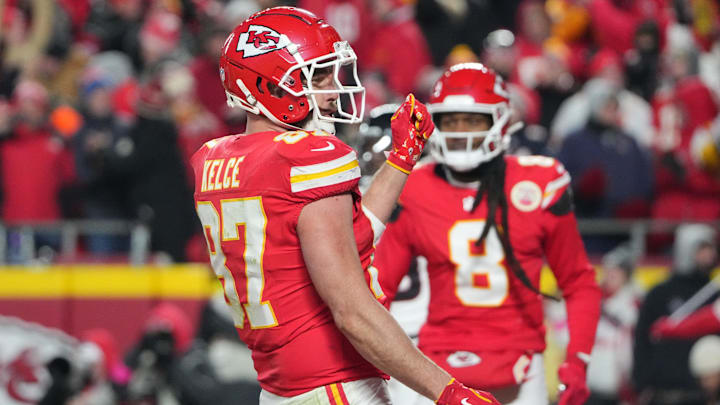 Jan 18, 2025; Kansas City, Missouri, USA; Kansas City Chiefs tight end Travis Kelce (87) reacts after catching a pass for a touchdown against the Houston Texans during the fourth quarter of a 2025 AFC divisional round game at GEHA Field at Arrowhead Stadium. Mandatory Credit: Denny Medley-Imagn Images